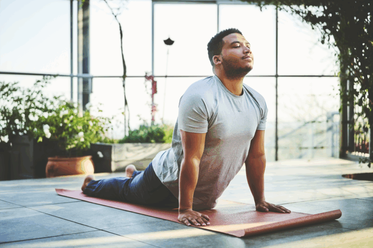 man doing Upward Facing Dog Pose