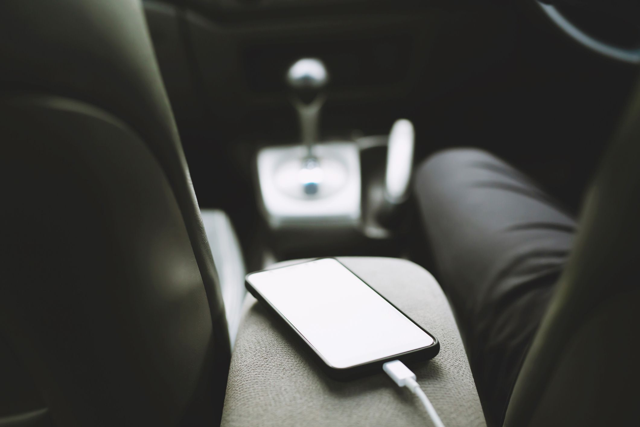 Close up view charge the battery phone in car. Place the mobile smart phone in the car. transportation and vehicle concept.
