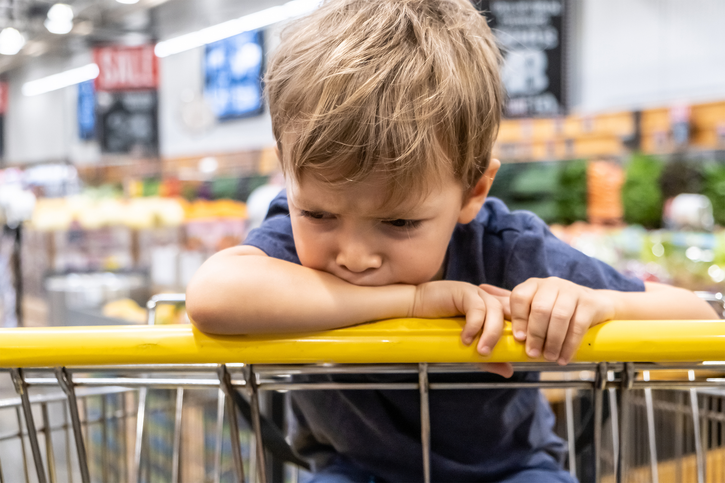 boy in shopping cart