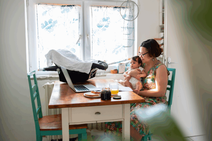 Working mom with baby in a lap