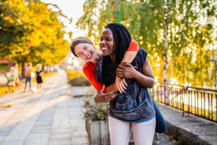 happy couple hugging in the park