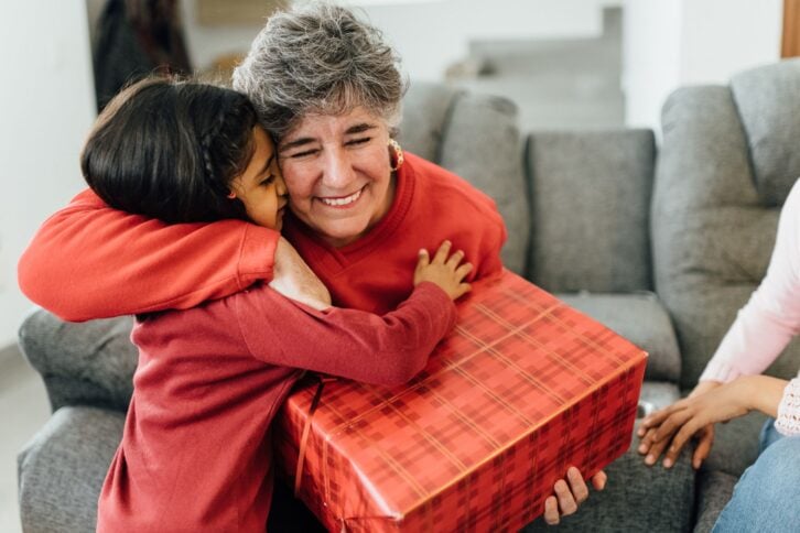 Mexican family opening presents on Christmas morning