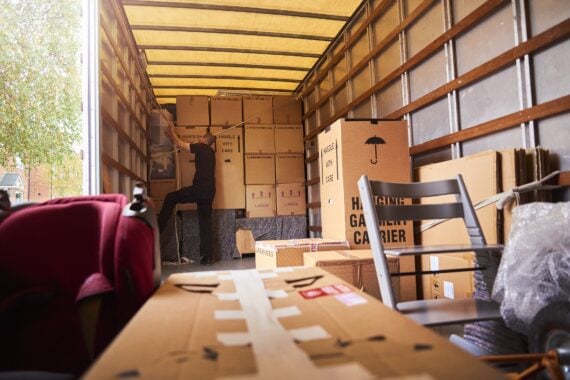 Removal company helping a family move out of their old home