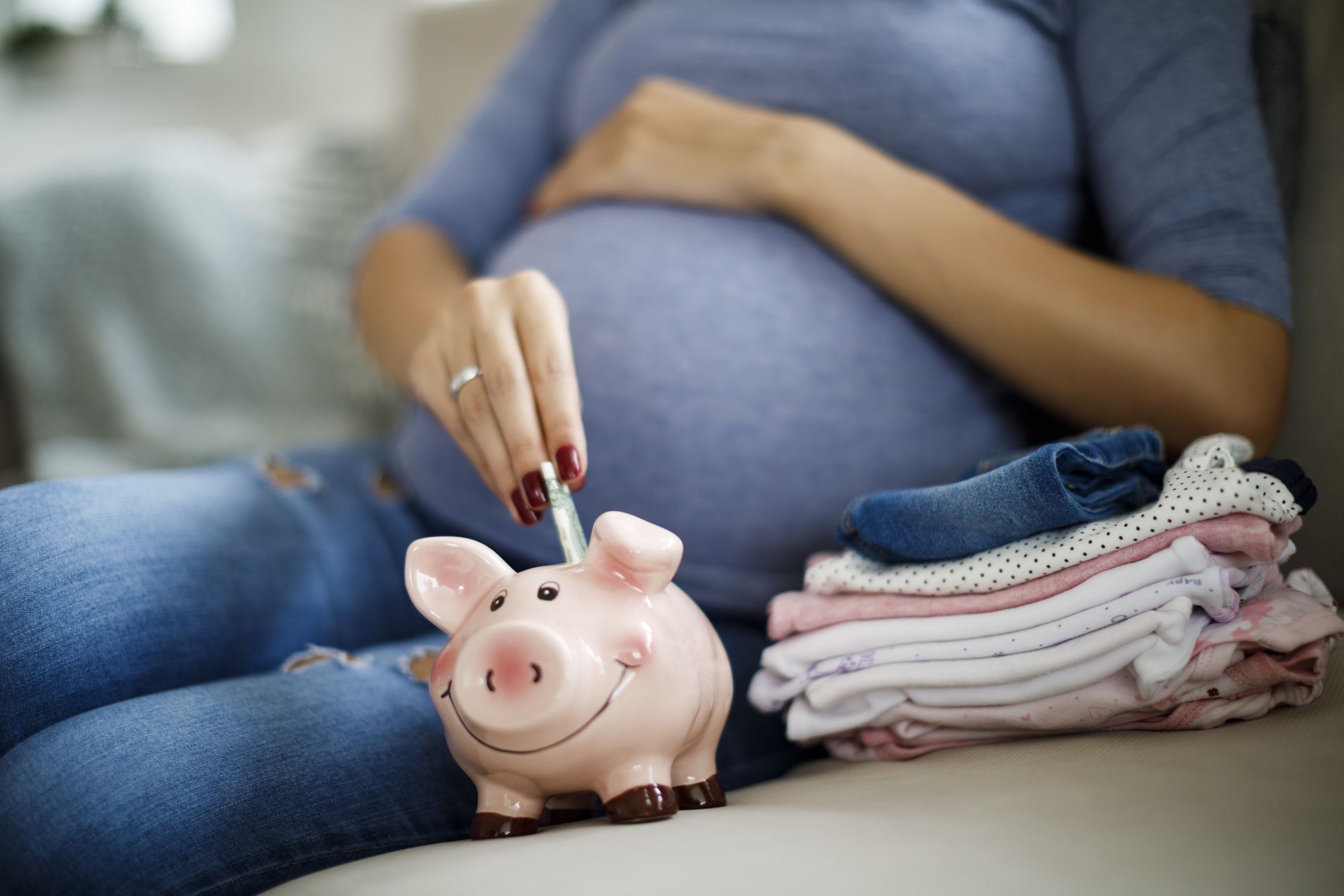 Pregnant woman saving up for baby