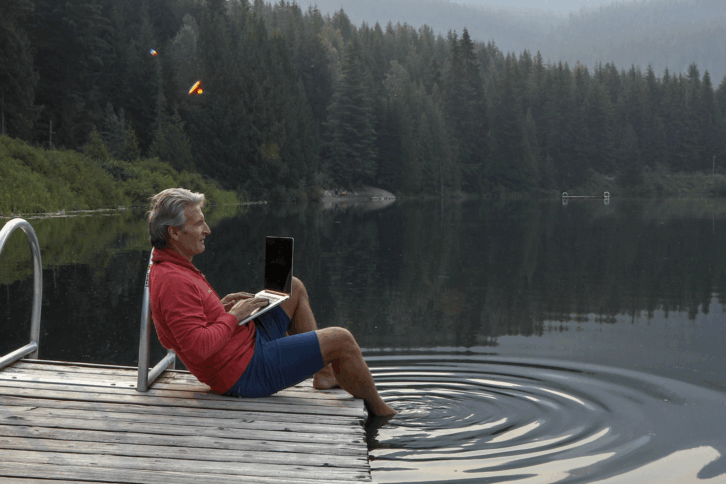 man working at a lake