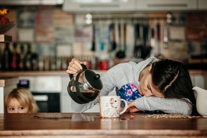 tired woman pouring coffee