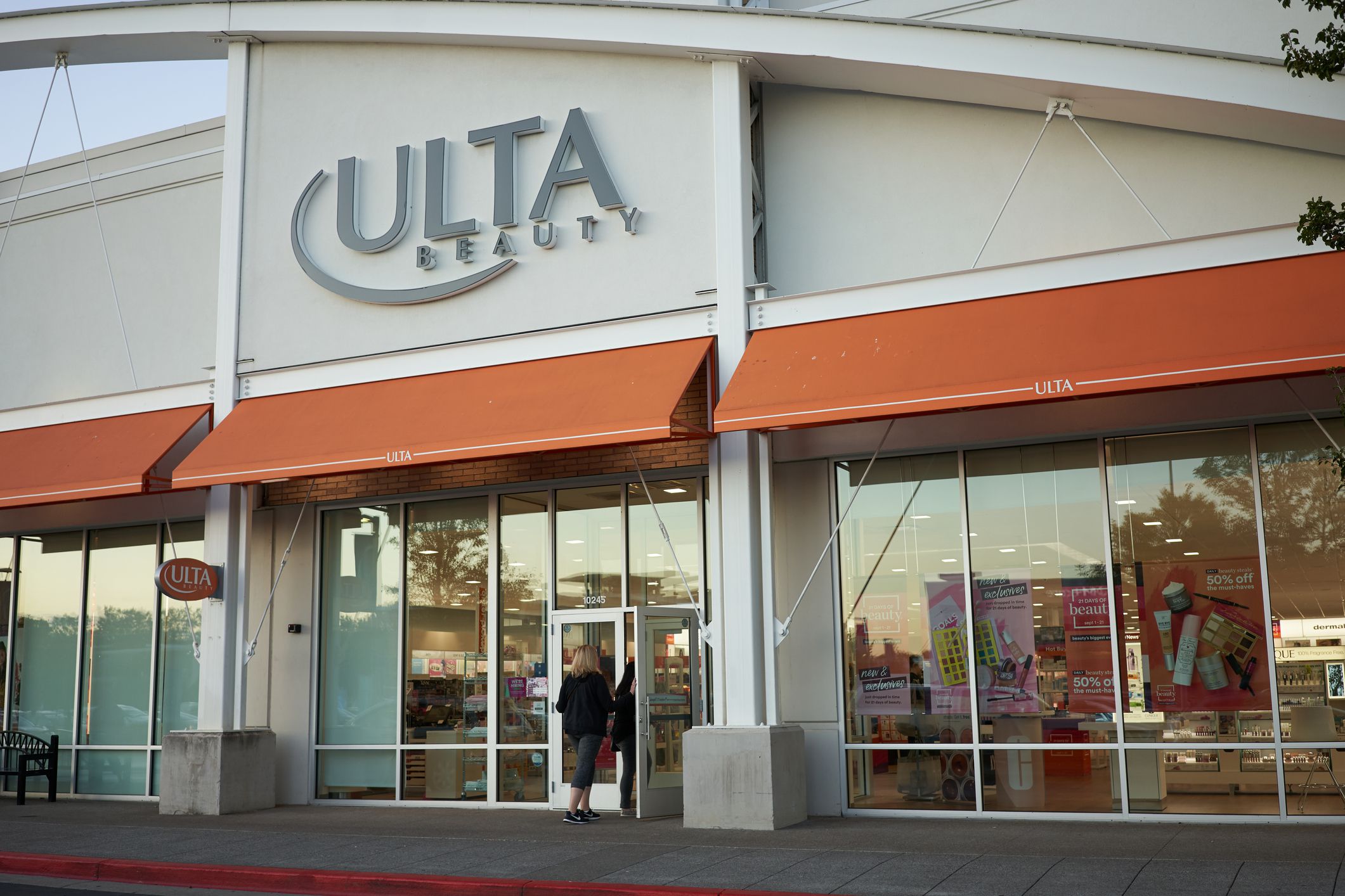 Portland, Oregon, USA - Sep 21, 2019: A shopping entering the Ulta Beauty Store in Portland's Cascade Station Shopping Center at dusk. Ulta Beauty, Inc., is an America chain of beauty stores headquartered in Bolingbrook, IL.