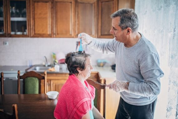 Senior husband dyes his wife’s hair
