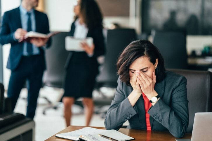 Young businesswoman having problems in the office