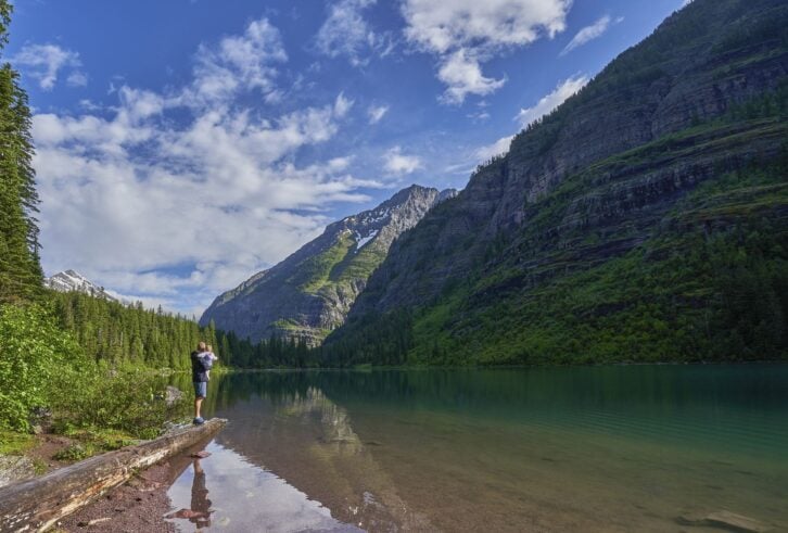 Father and Baby Daughter in the Beautiful Natural Scenery of Glacier National Park's Avalanche Lake Area in Montana, USA.