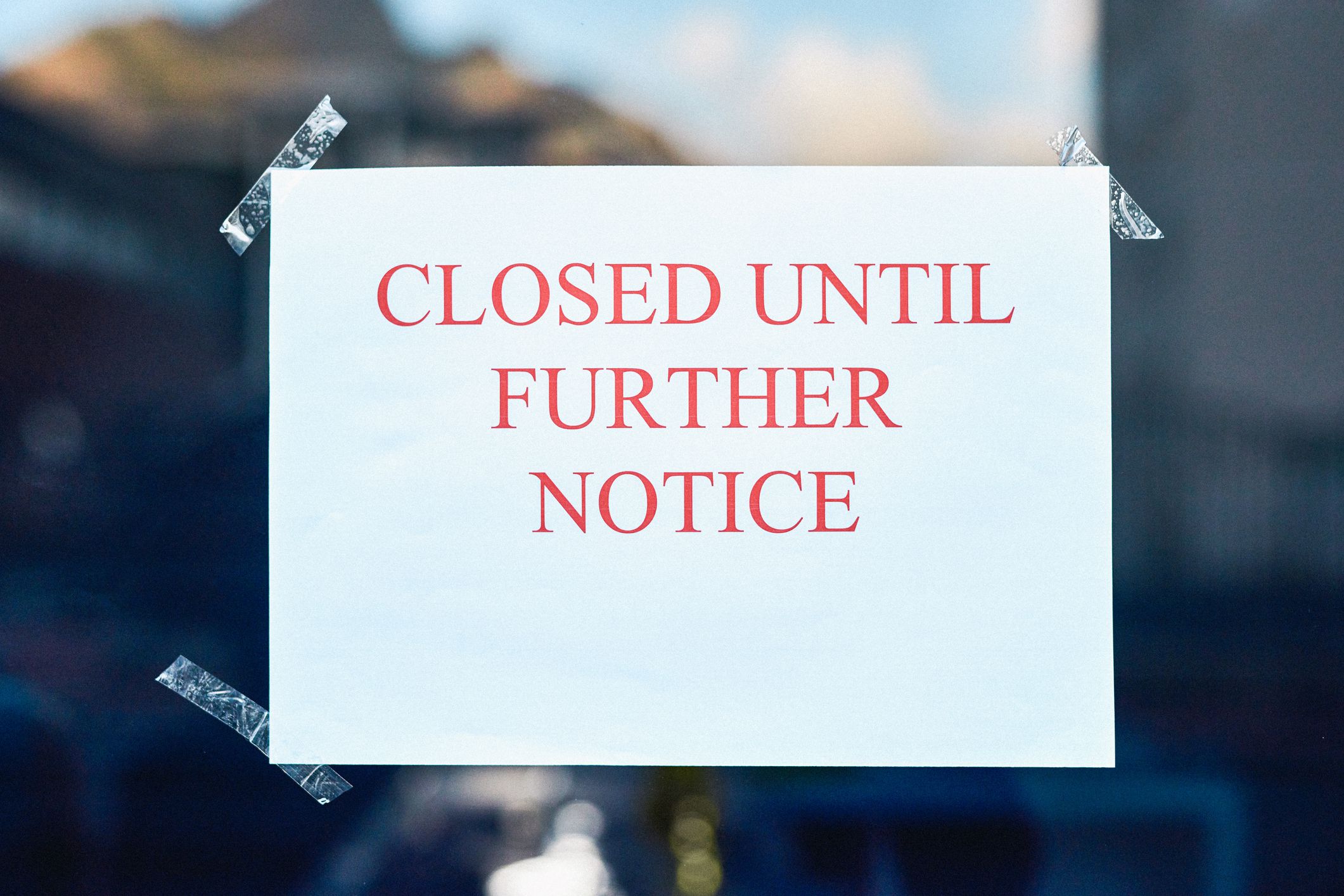 Shot of a closed sign on the entrance of a business