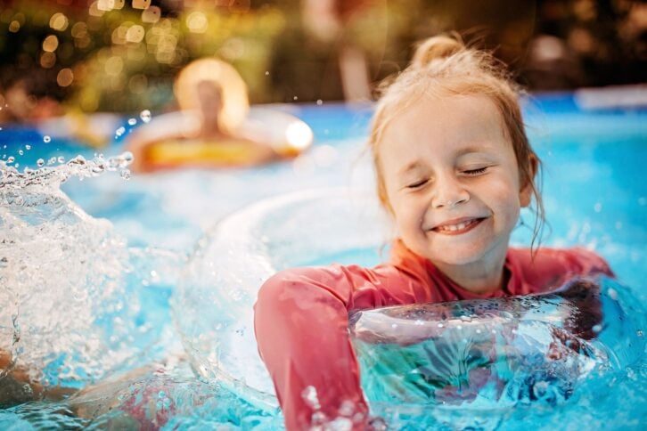 Kid playing in pool