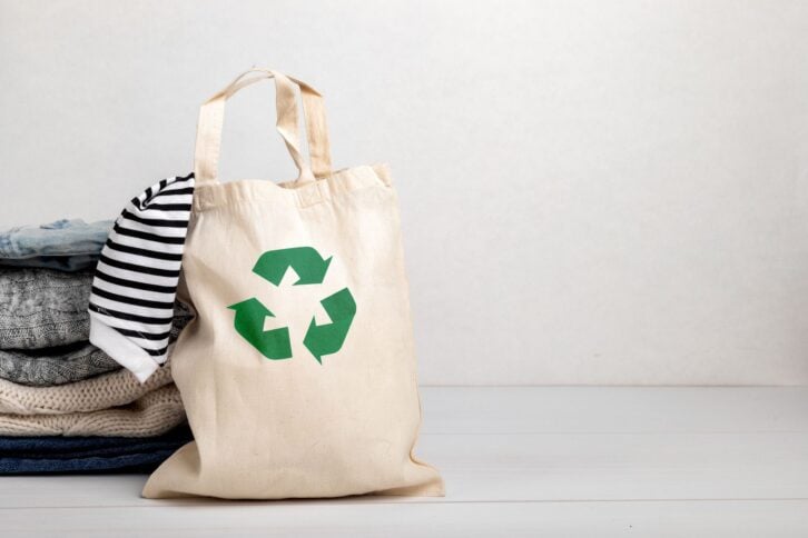 Second hand wardrobe idea. Circular fashion, eco friendly sustainable shopping, thrifting shop concept. Woman outfit.