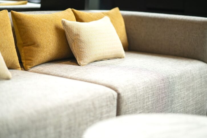 close up soft  pillow cushion attange on sofa at garden patio hotel area furniture design ideas concept