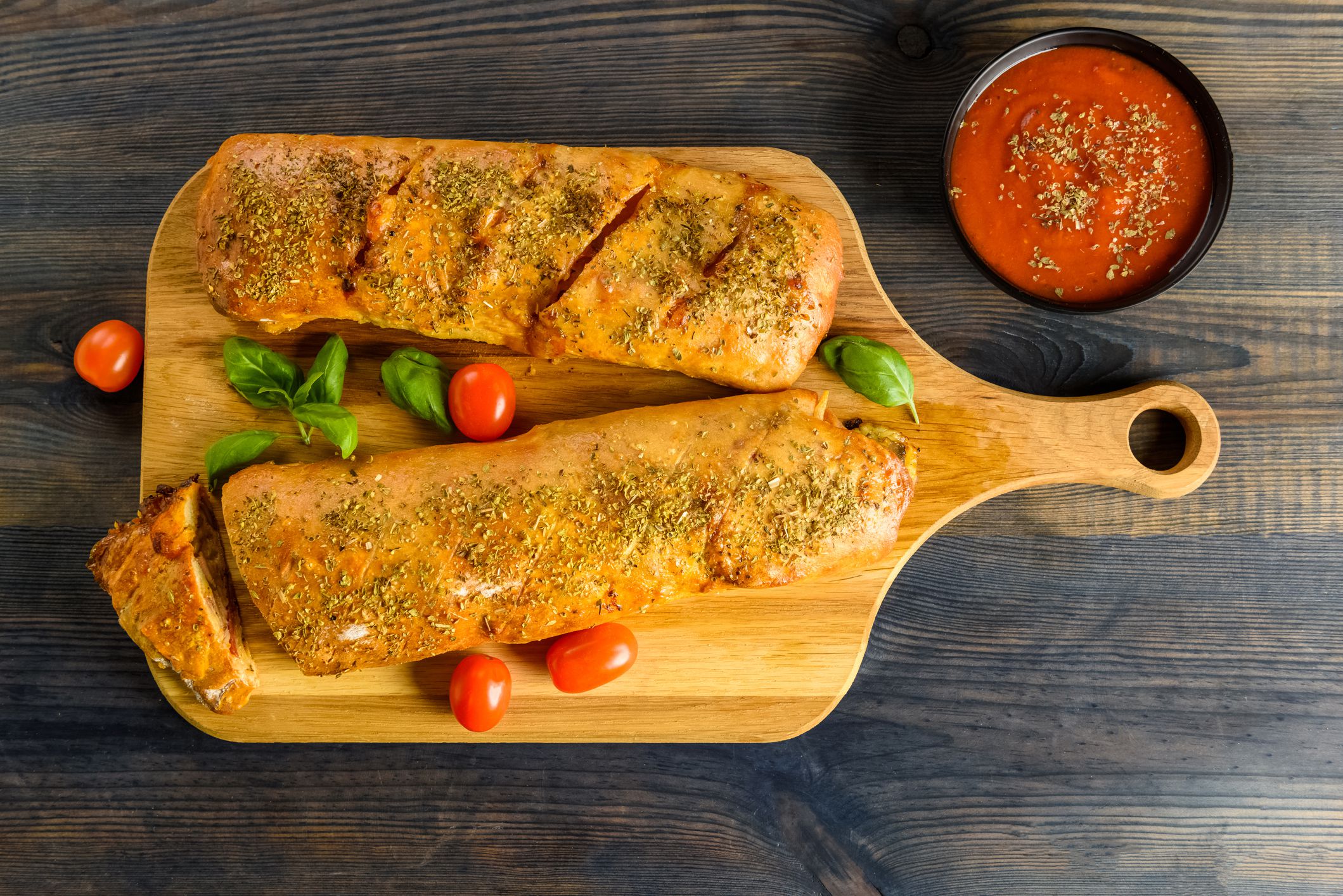 Pizza stromboli on a wooden background