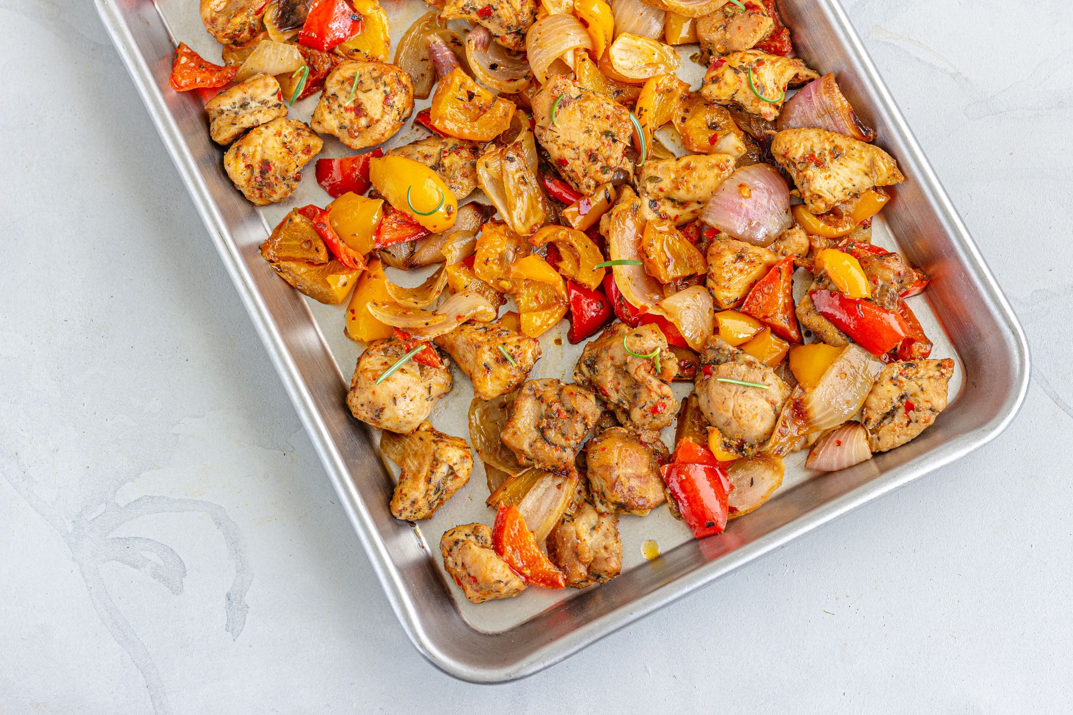 One Pot Baked Chicken and Veggies on a Baking Tray Top Down Photo