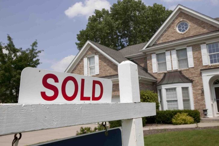 sold sign in front of house
