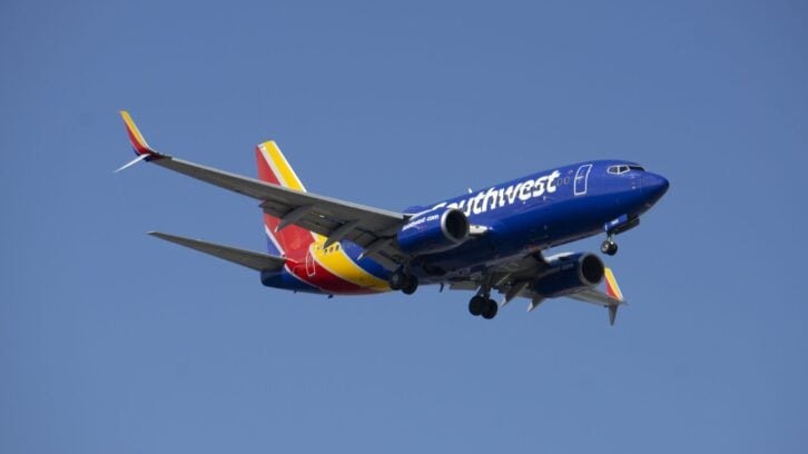 Schiller Park, IL, USA. Southwest Airlines plane prepares for landing at Chicago O'Hare International Airport.