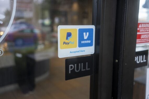 Sherwood, OR, USA - Oct 1, 2021: PayPal and Venmo Accepted Here sticker is seen at the entrance to a Panda Express restaurant in Sherwood, Oregon.