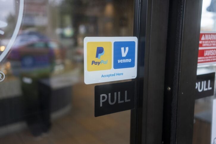 Sherwood, OR, USA - Oct 1, 2021: PayPal and Venmo Accepted Here sticker is seen at the entrance to a Panda Express restaurant in Sherwood, Oregon.