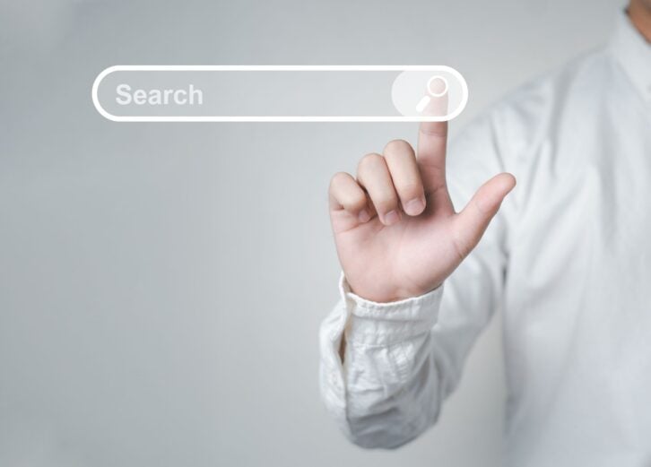 Man standing with hands pointing to information search is a data clicking to virtual internet search page computer touch screen. Education, Knowledge, Analysis the Internet to connect wirelessly.