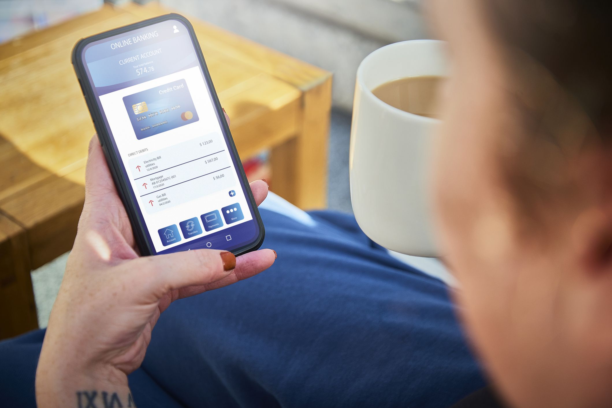 A woman using her online banking app at home