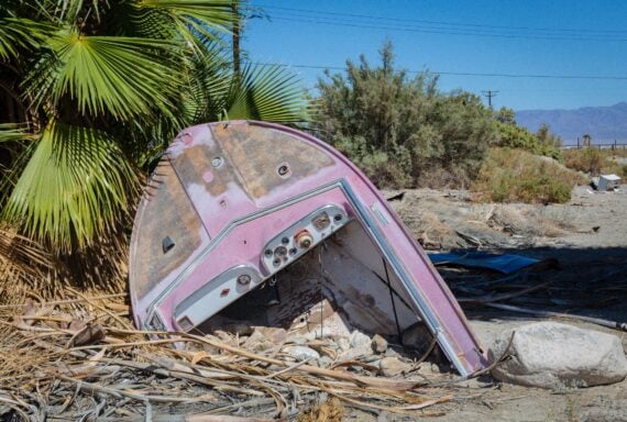 a photo of old broken purpule boat