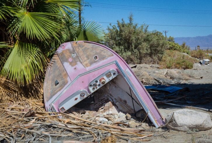 a photo of old broken purpule boat