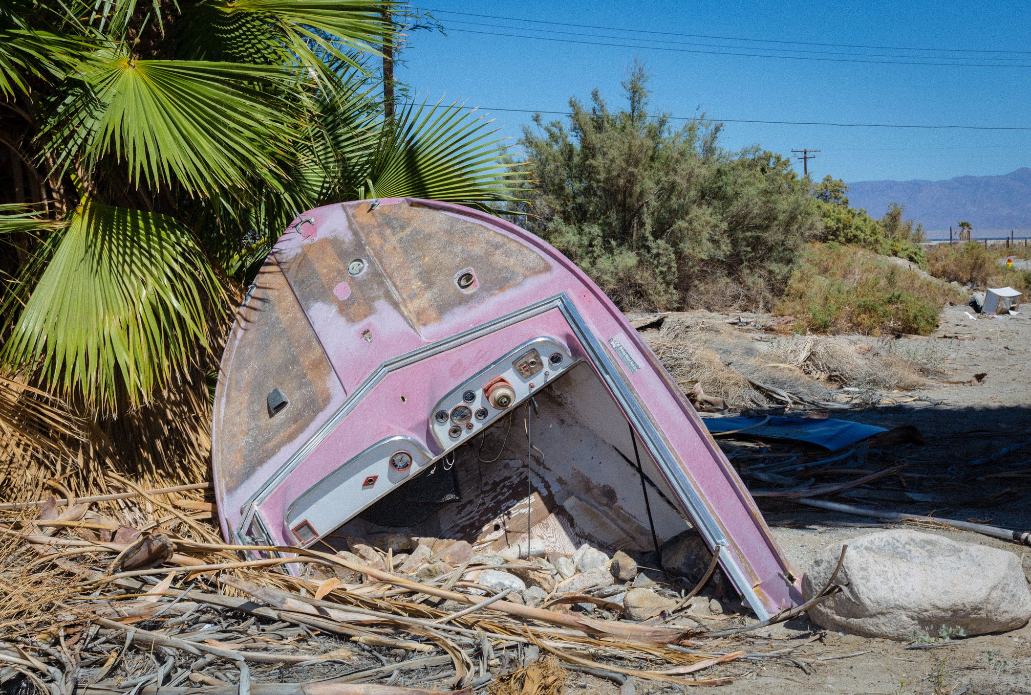 a photo of old broken purpule boat