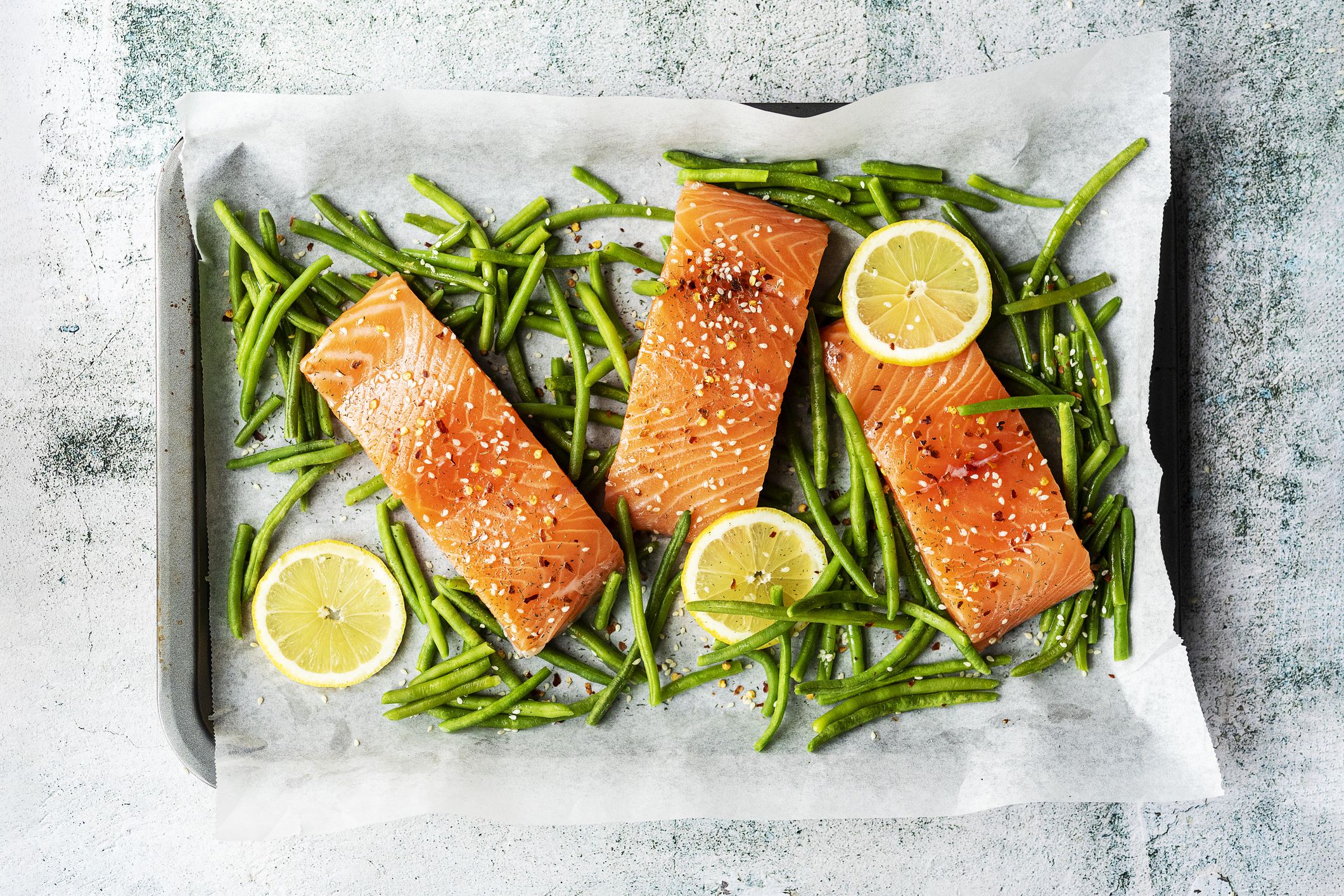 prepared salmon fillet portions ready for oven cooking.