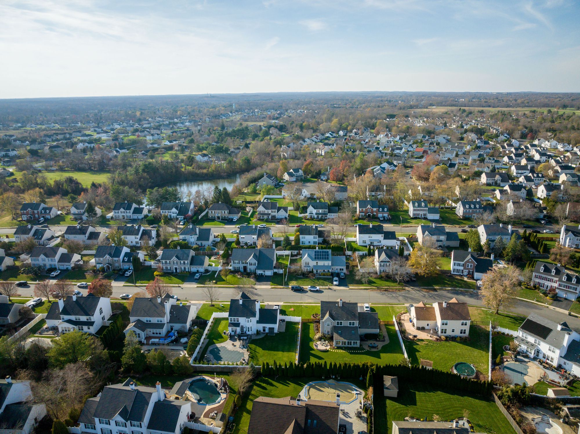 A drone shot of beautiful houses in Freehold, New Jersey, United States in summer