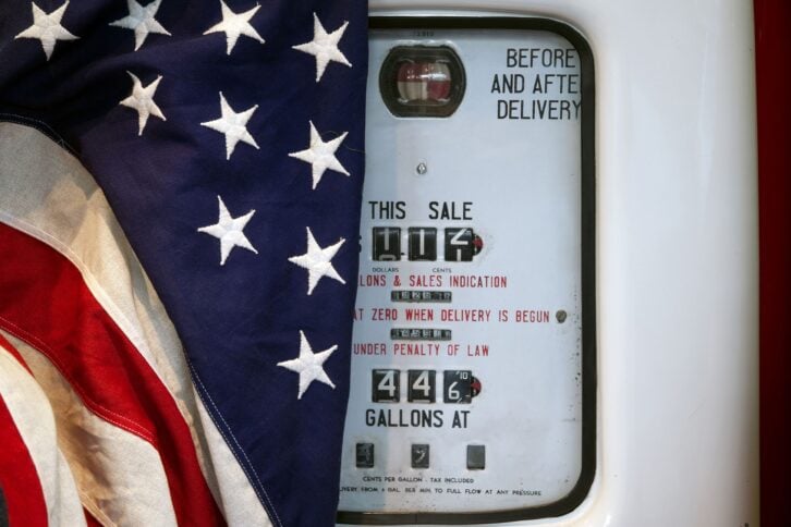 American flag over old-school gas pump