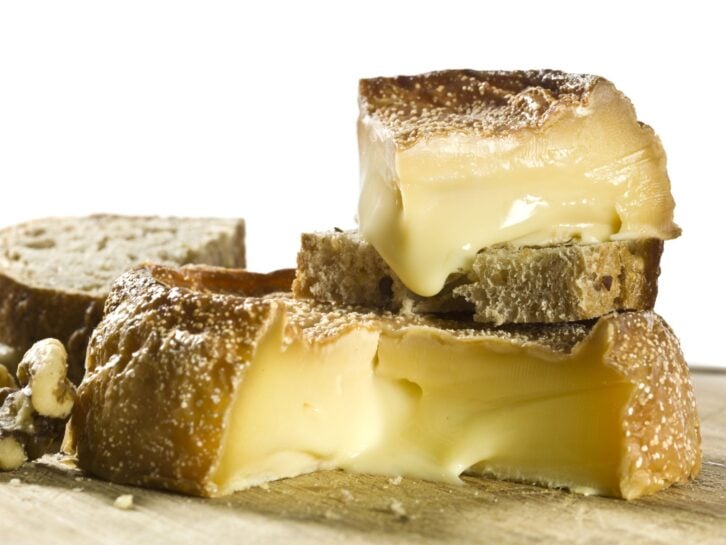 Époisses de Bourgogne French cheese on white background. (this picture has been shot with a High Definition Hasselblad H3D II 31 megapixels camera and 120 mm f4H Hasselblad macro lens)