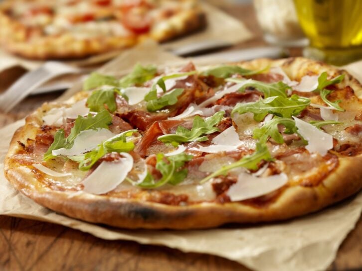 Authentic Italian, Hand Made Prosciutto and Arugula Pizza with Fresh Parmesean Cheese  - Photographed on a Hasselblad H3D11-39 megapixel Camera System