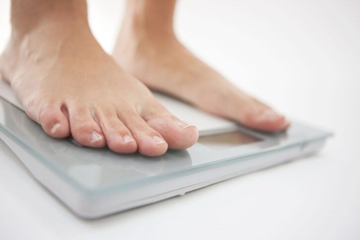 person standing on weight scale