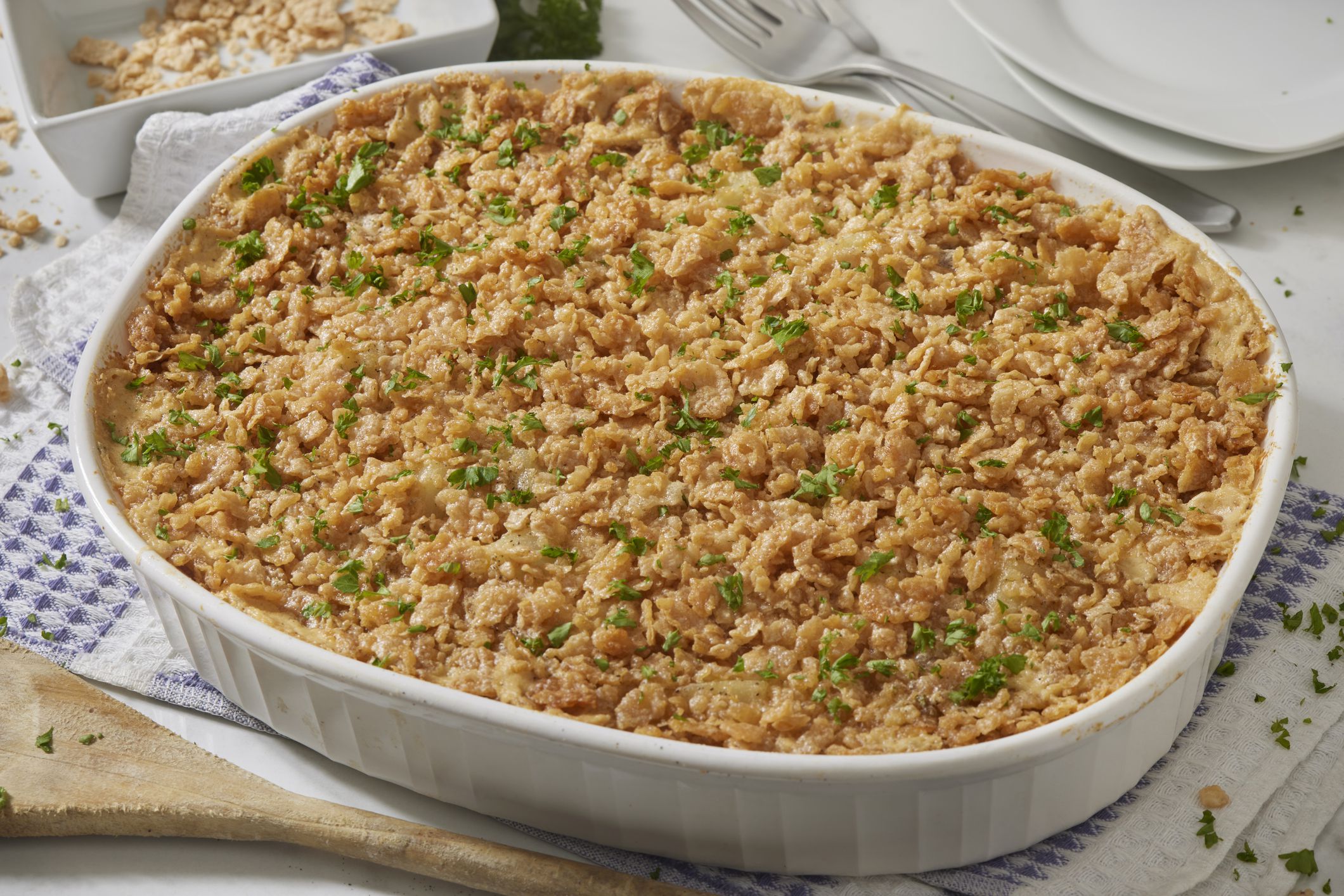 Cheesy Hash Brown Casserole. AKA Funeral Potatoes. Made with Cream of Mushroom Soup, Sour Cream, Cheddar Cheese and a Corn Flake Crust