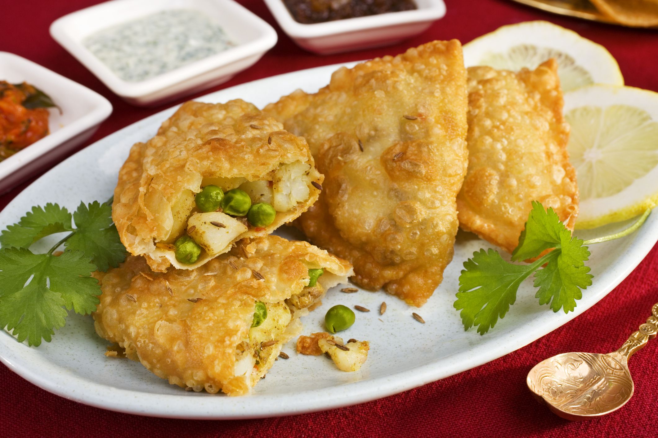 Potato and pea samosas with three chutneys. More curry
