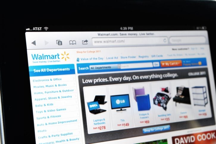 Raleigh, NC - USA - June 27, 2011: Woman Holding an iPad Displaying Walmart Web Site.