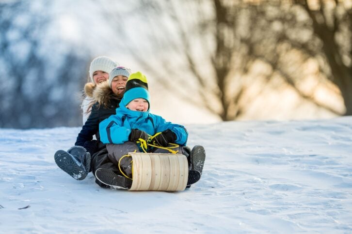 Kids having fun on the tobbogan hill