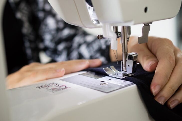 woman sewing with sewing machine