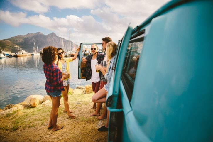 Hipsters near camper van