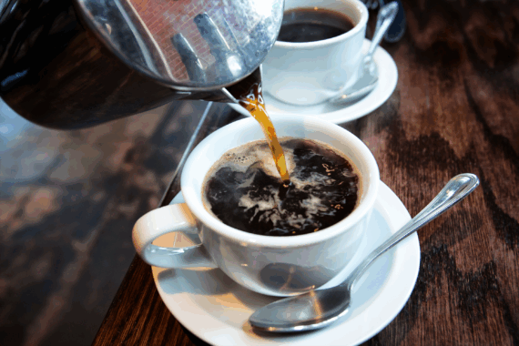 pouring cup of hot coffee