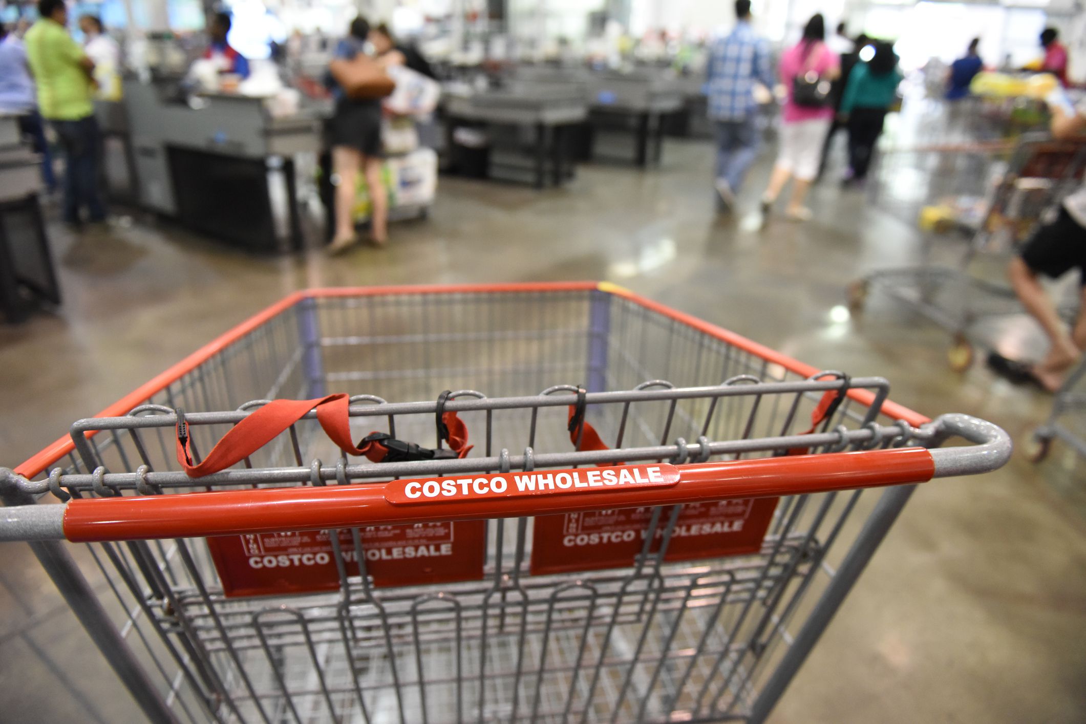 New York City - USA - June 29 2015: interior of Costco, focus on shopping cart handle with Costco logo