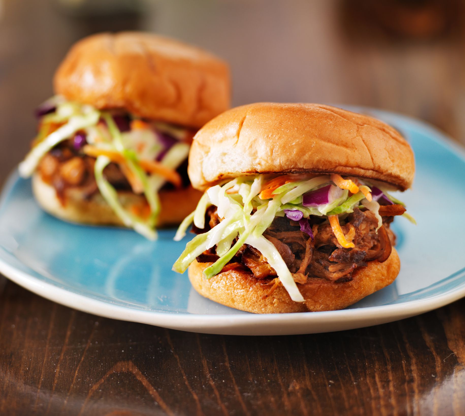 pulled pork with bbq sauce on a blue plate