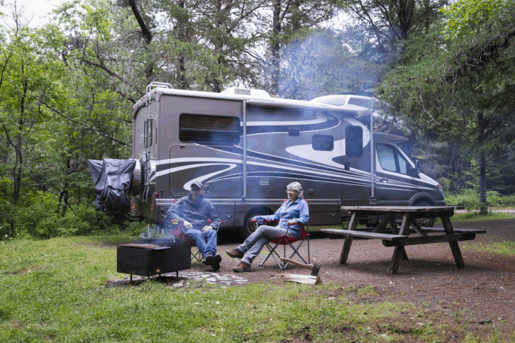 couple outside at an RV campground