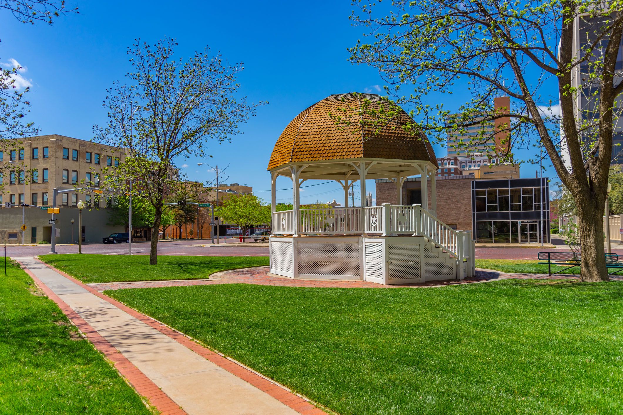 spring begins in the downtown lubbock with a white gazebo and walkway ,texas