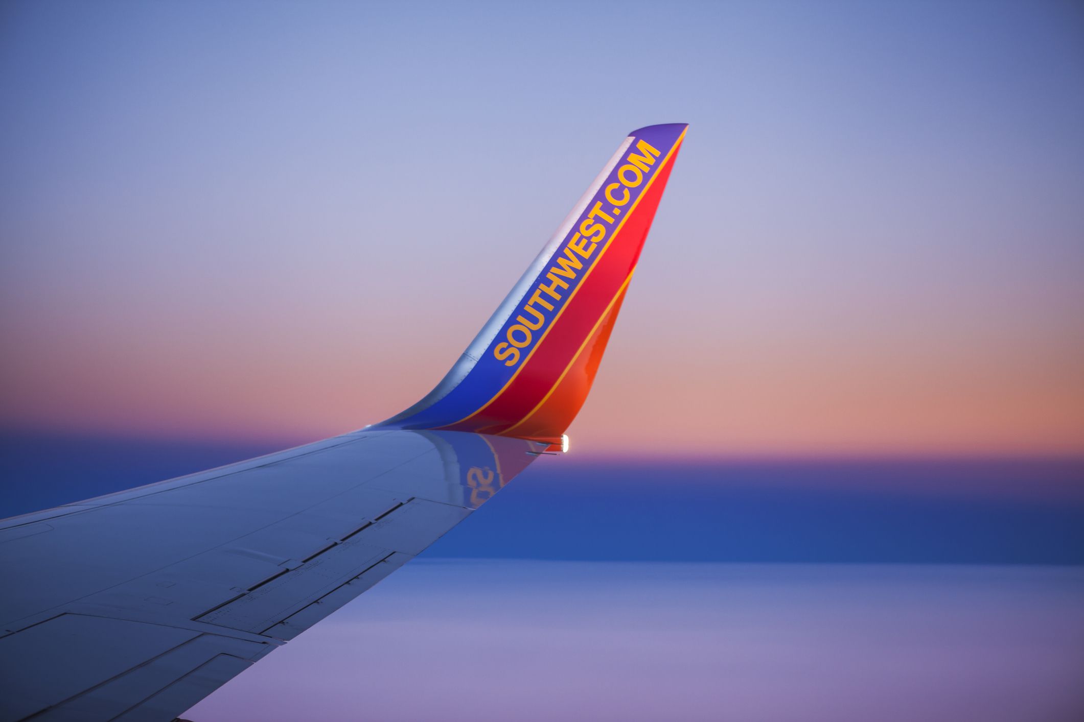 Orlando, Florida, USA - December 2, 2013: A curved winglet with the Southwest.com web site address on the wing of a Boeing 737 airplane operated by Southwest Airlines.