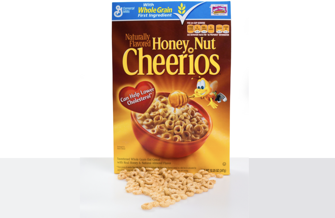 New York City, New York, USA - August 13, 2014: Box of Honey Nut Cheerios cereal against white background. This General Mills variation of Cheerios is the best selling cereal in the United States.