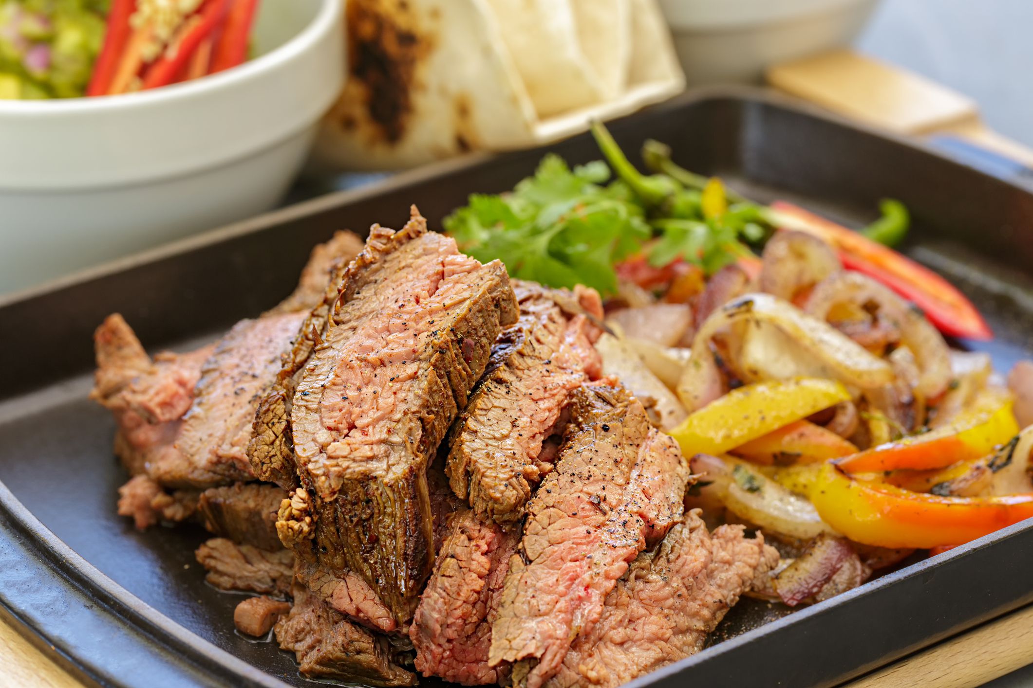 Beef fajitas with sauteed vegetables, guacamole and pico de gallo