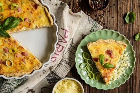 Traditional French Quiche Lorraine with Cheddar, Camembert, bacon and eggs